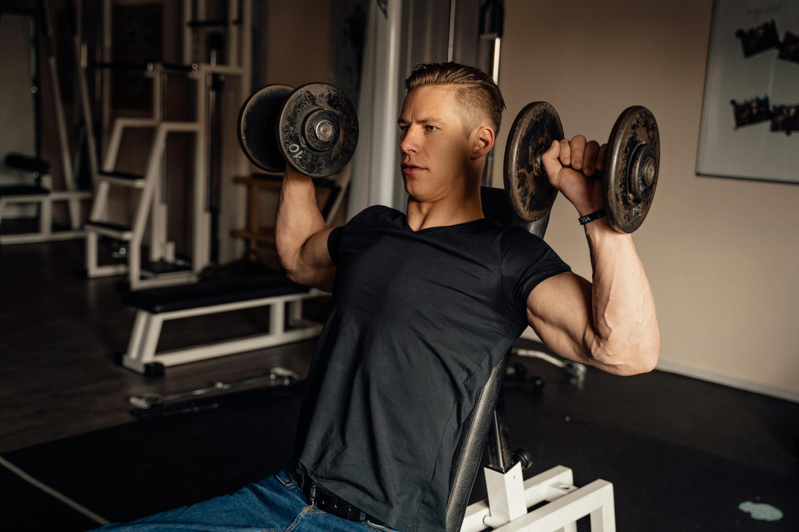 A Man Doing a Dumbbell Shoulder Press · Free Stock Photo