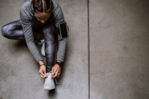 Young athlete jogging in underground garage