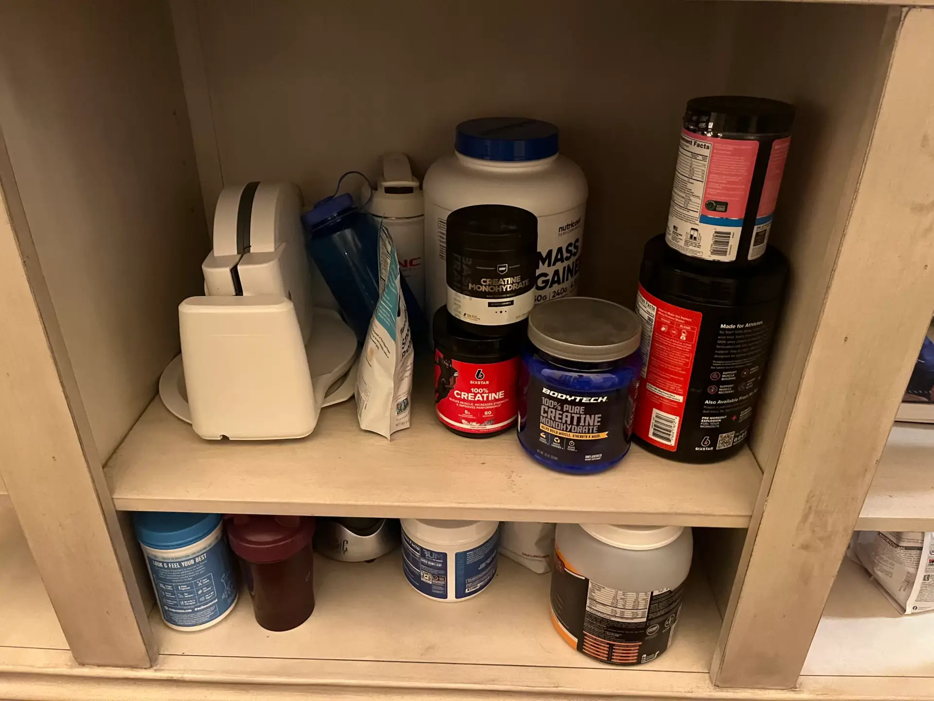 creatine and other supplements stored in a pantry